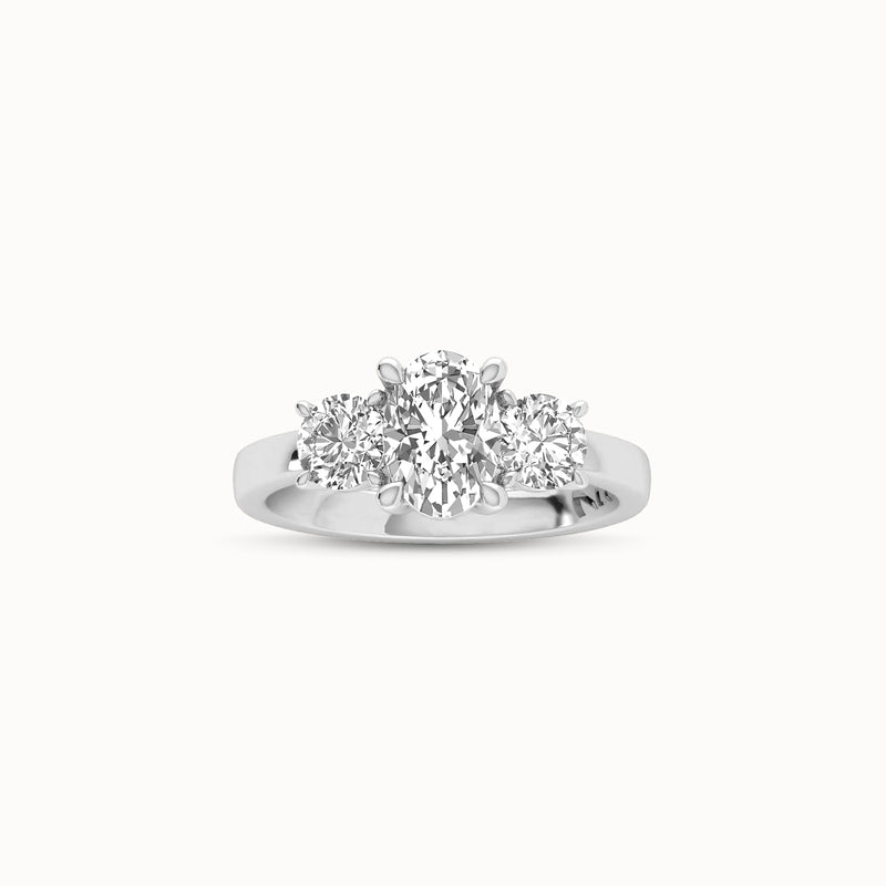 1OV102RD80 - Oval Three Stone Engagement Ring with Round Side Accents
