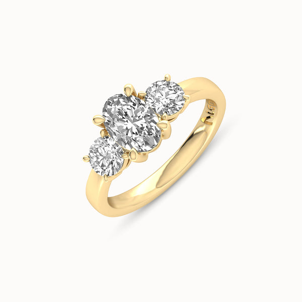 1OV102RD80 - Oval Three Stone Engagement Ring with Round Side Accents