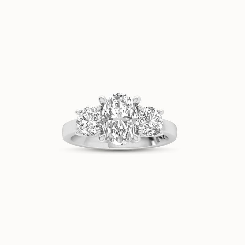 1OV152RD110 - Oval Three Stone Engagement Ring with Round Side Accents