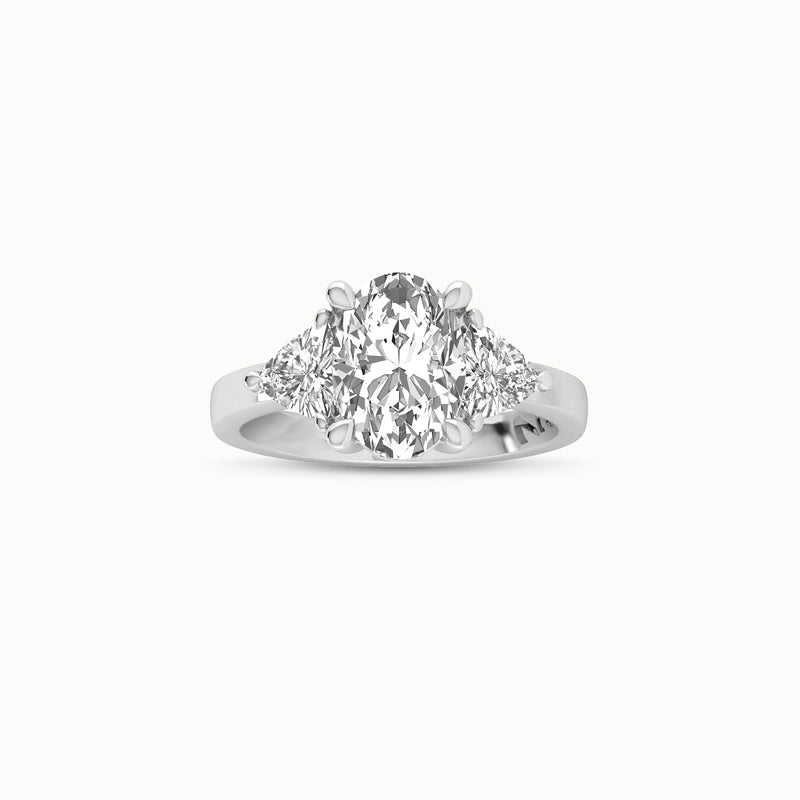 1OV202TR120 - Oval Three Stone Engagement Ring with Trillian Side Accents